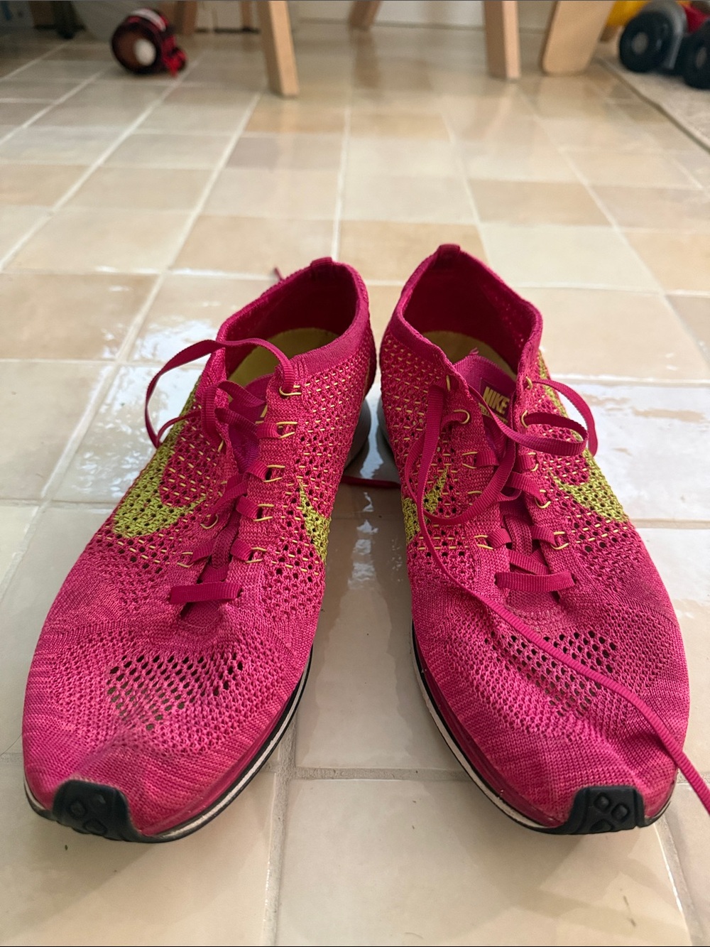 Nike Women’s Pink Flyknit Running Shoes with Yellow Swoosh - Size 10